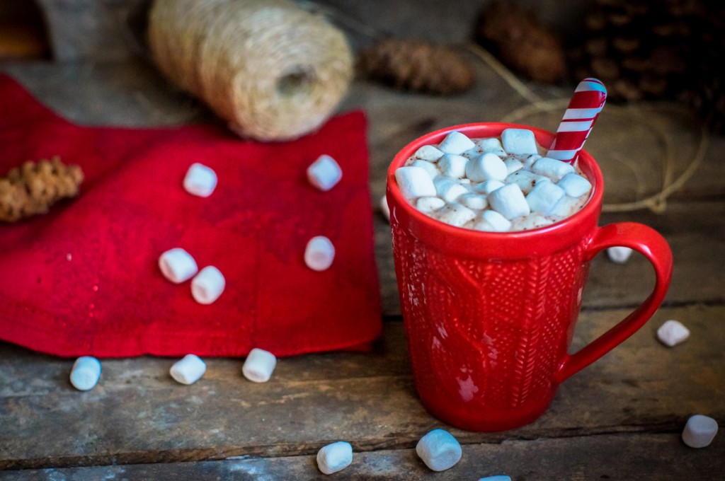 Red knitted mug filled with hot chocolate